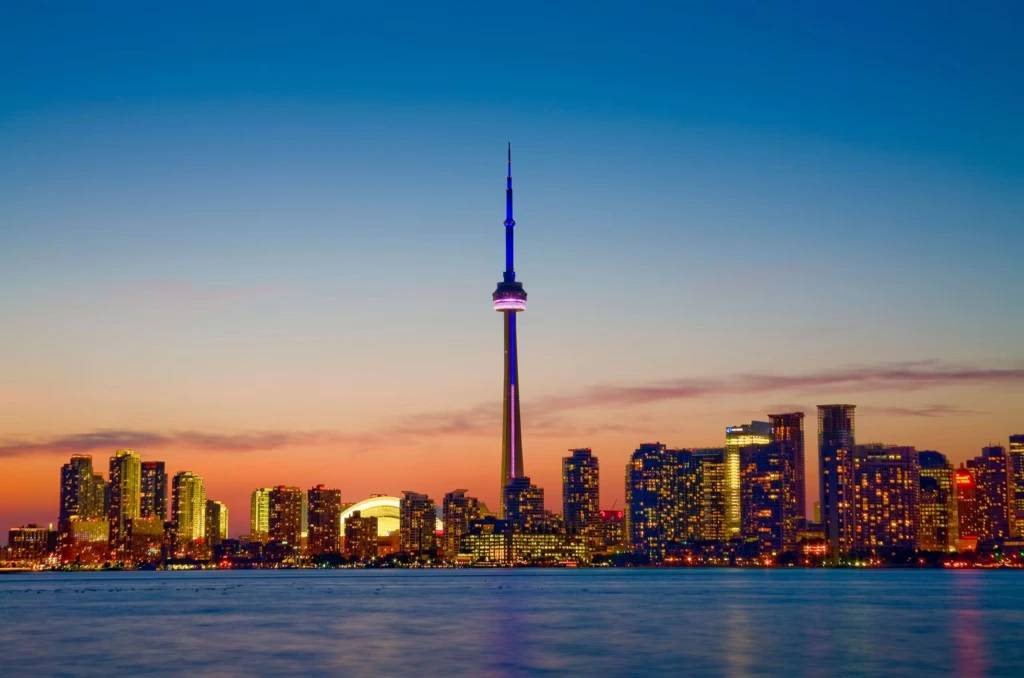 CN Tower and Toronto skyline at sunset representing Devtrest’s Canada office.